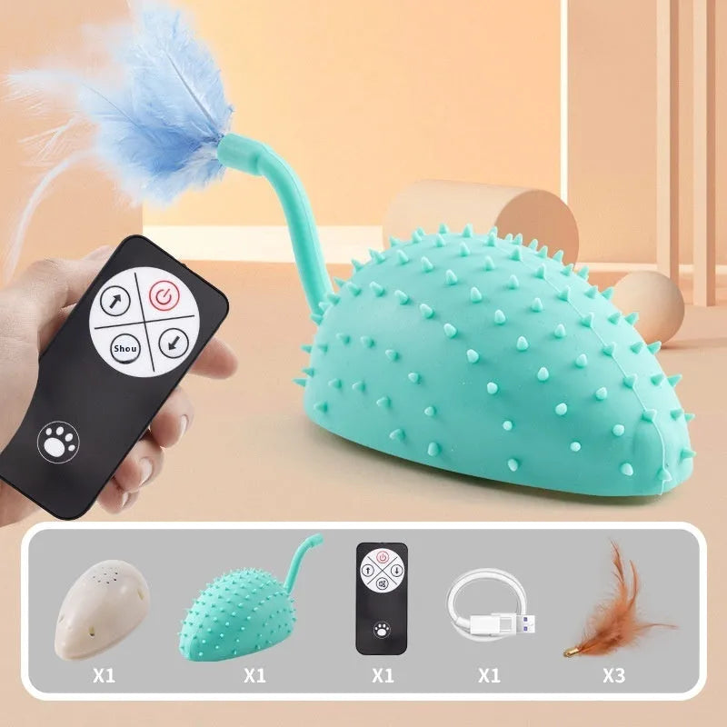 Remote control and USB rechargeable silicone mouse-shaped cat toy with attached feathers, in cyan colour.