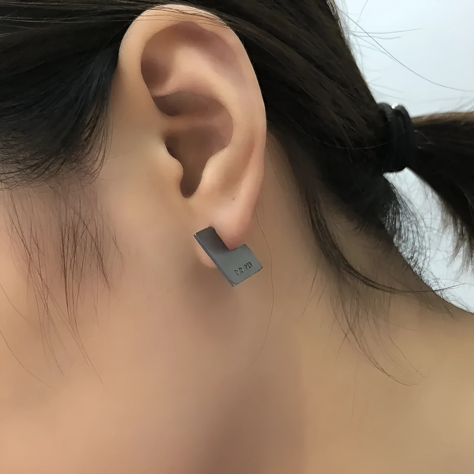Oxidation black geometric square sterling silver earrings on a white background.