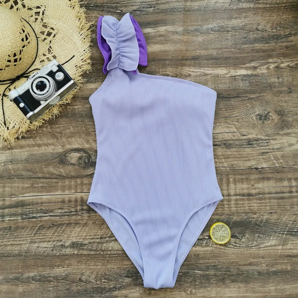 Women's single-shoulder suspender tube top one-piece swimsuit in a solid colour with a high-waist design.