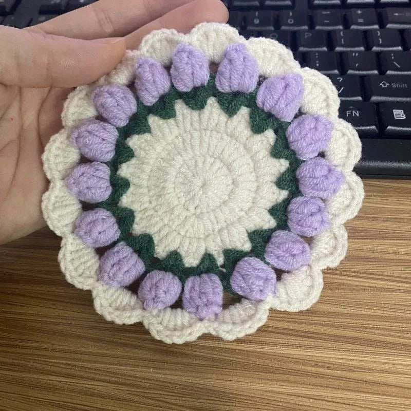 Handmade woven floral coaster in cotton and linen yarn with crochet hook construction