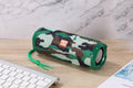 Portable fabric-cased Bluetooth speaker with card holder in multiple colour options.