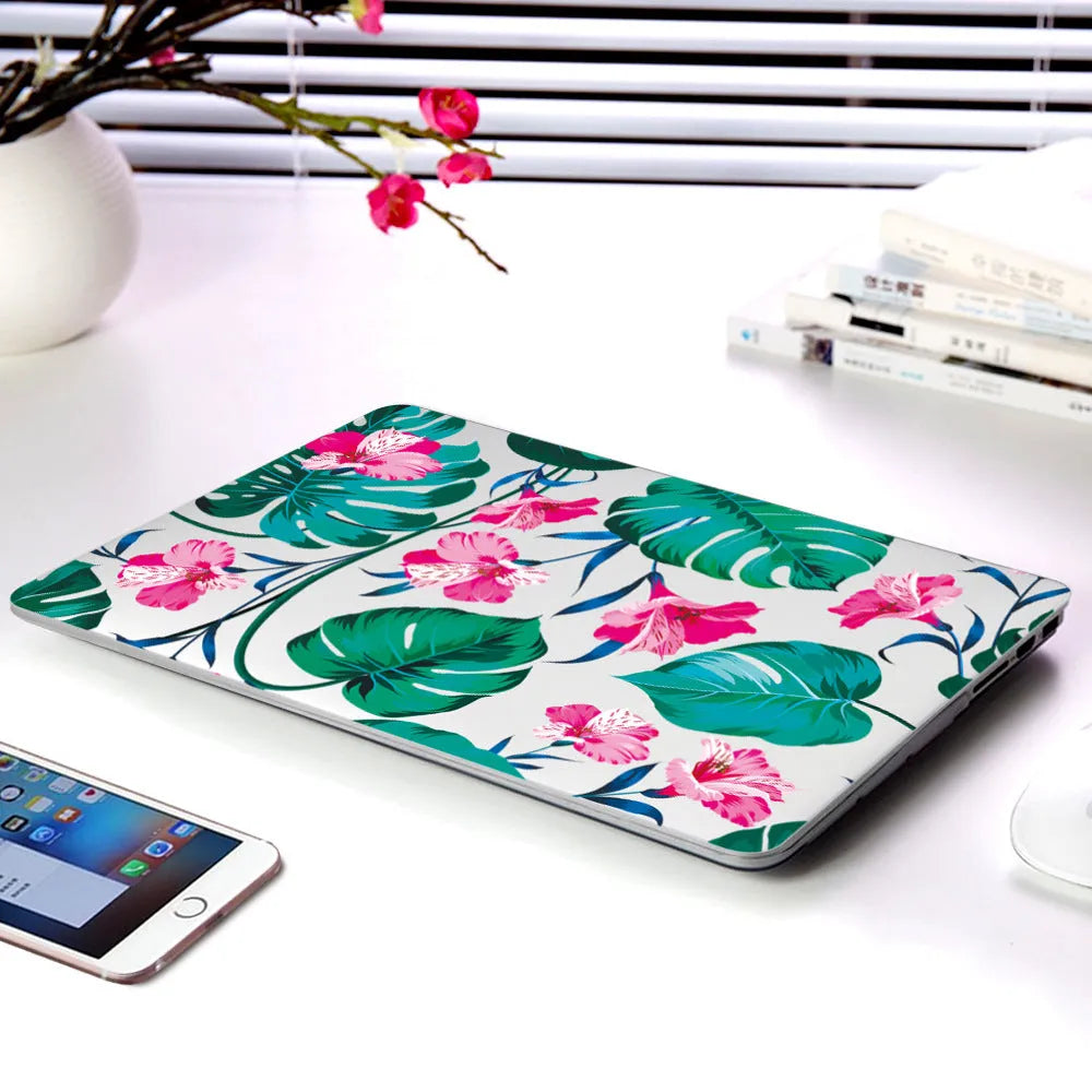 Plastic hard shell case with floral pattern for Apple MacBook Air and MacBook Pro laptops.