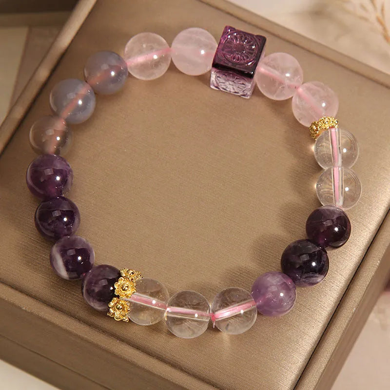 Purple women's amethyst crystal bracelet with rhinestone detailing measuring 10mm diameter