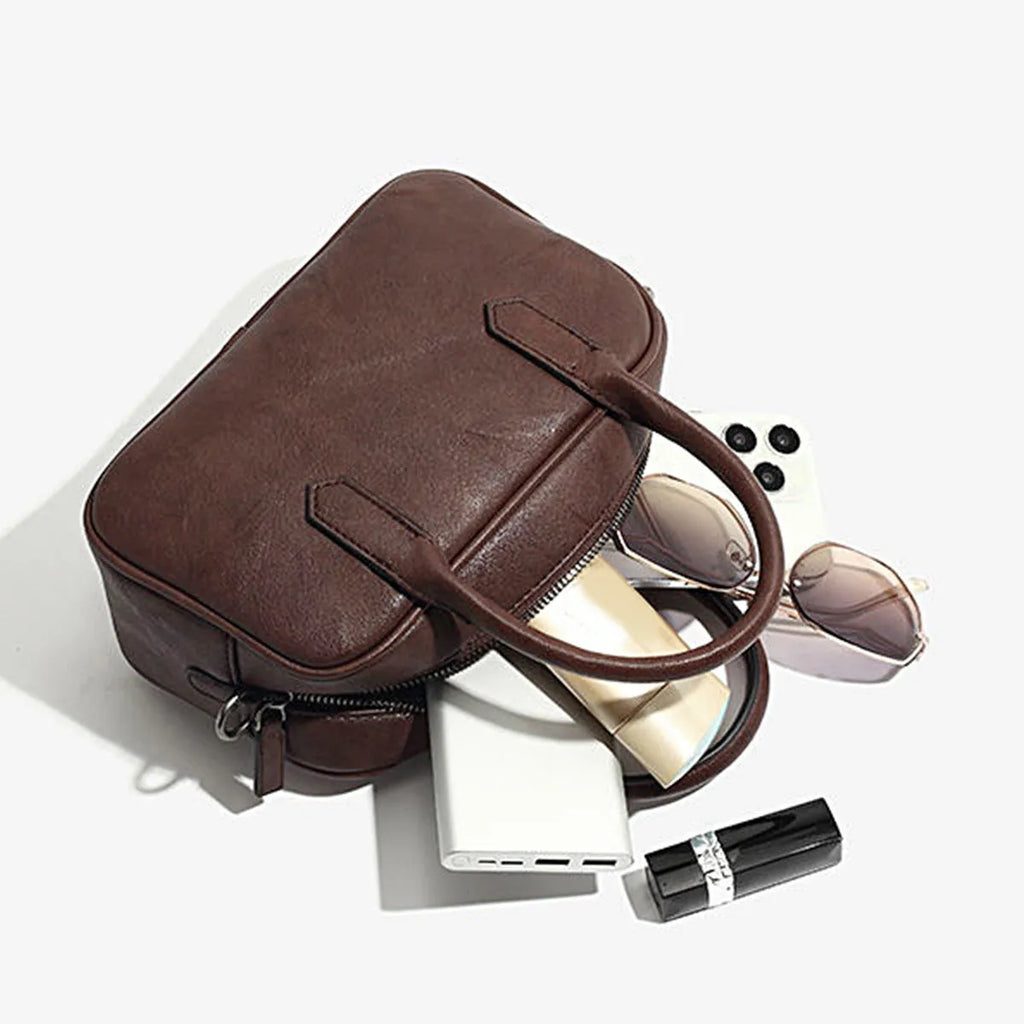 Retro square shoulder messenger bag in black PU leather with a single strap.