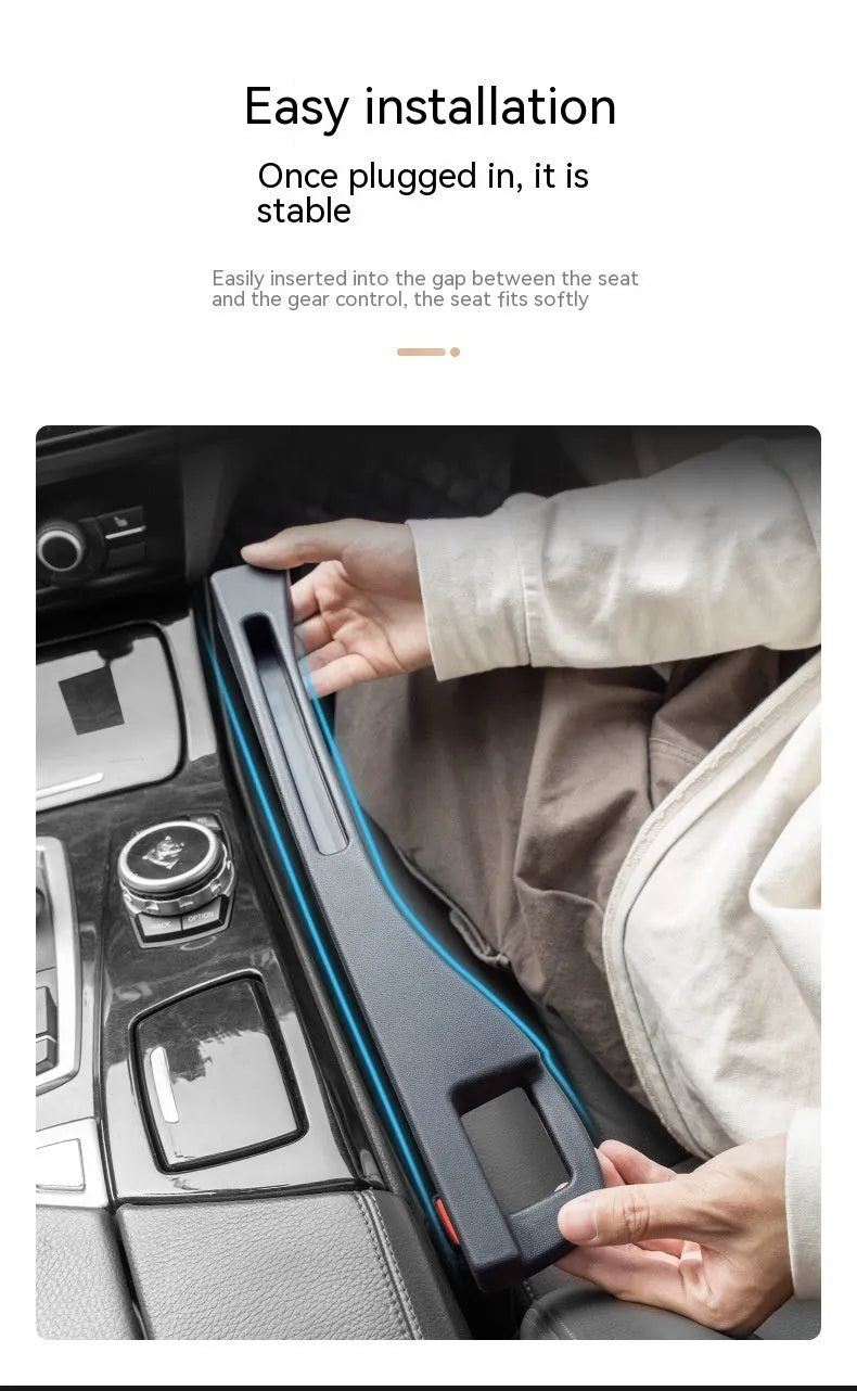 Black car seat gap storage box organiser with handle placed between vehicle seats