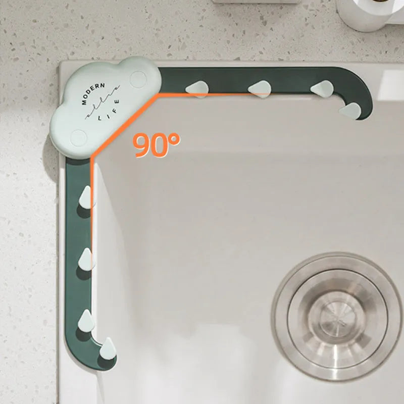 Triangular grey sink drain rack with mesh filter bag in kitchen sink corner