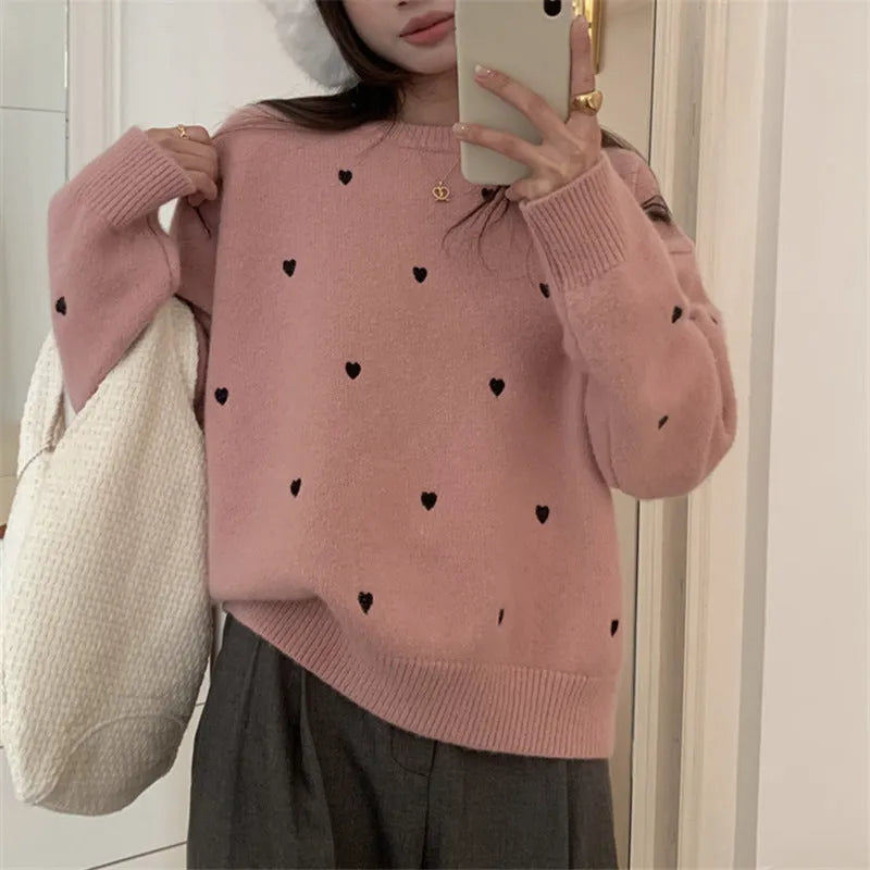 Loose beige women's pullover sweater with crew neck, long sleeves, and chest embroidery.