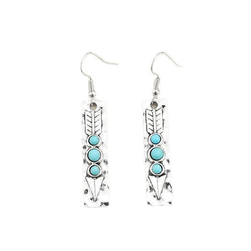 Long geometric silver earrings with turquoise inlay detail, retro style women's jewellery