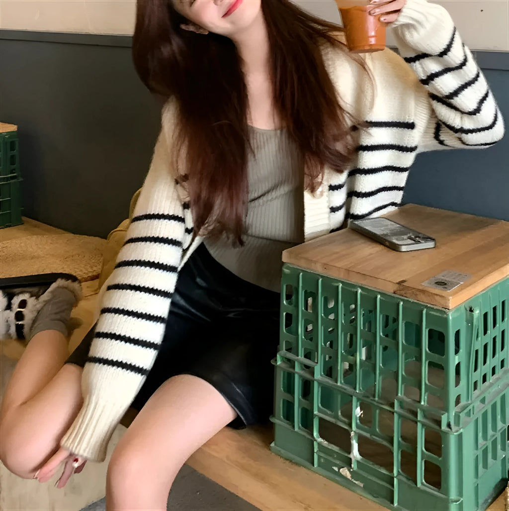 Japanese Korean style cardigan sweater with 3D pattern and button collar on a hanger.
