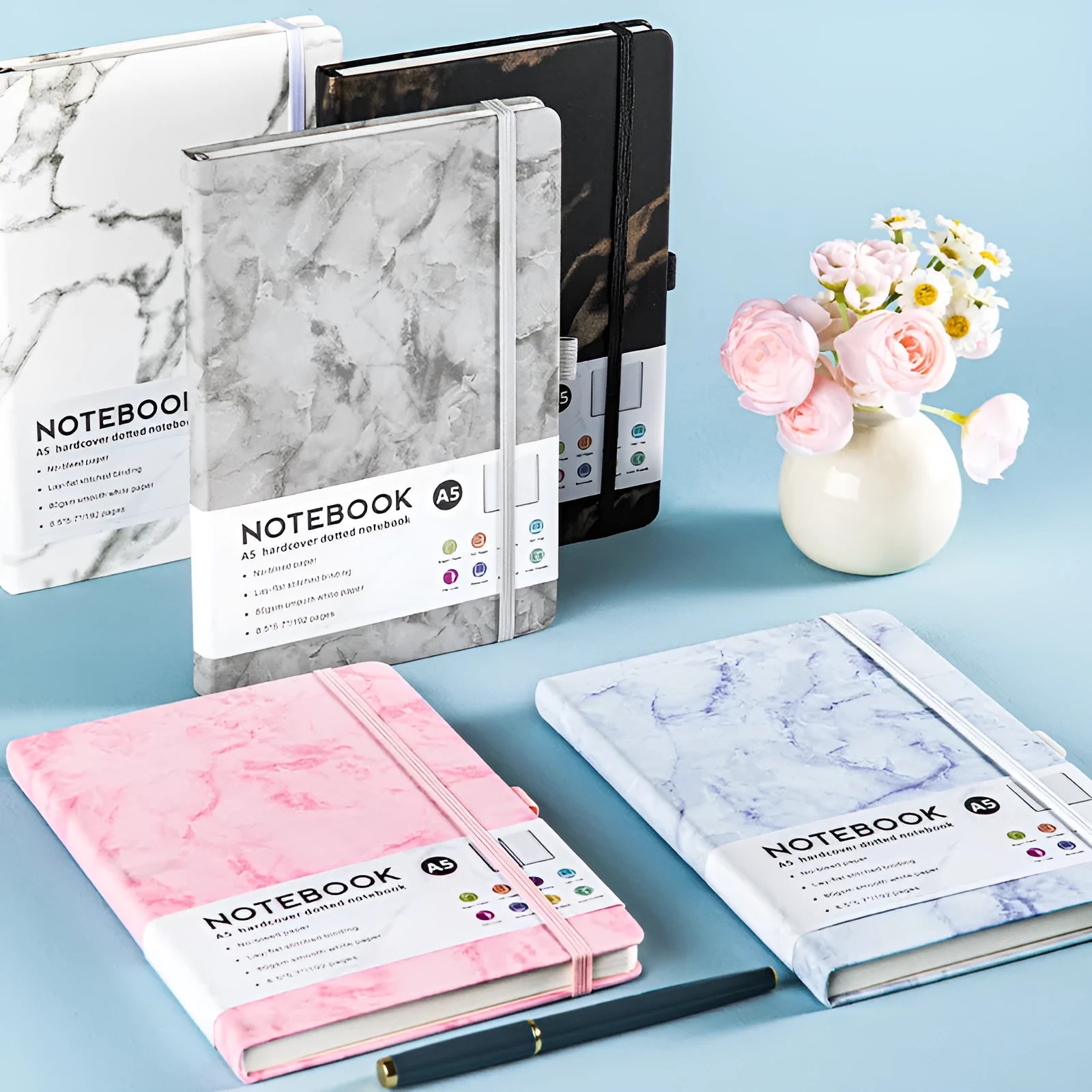 A5 soft touch PU leather notebook open on lined pages, shown in multiple colour options.