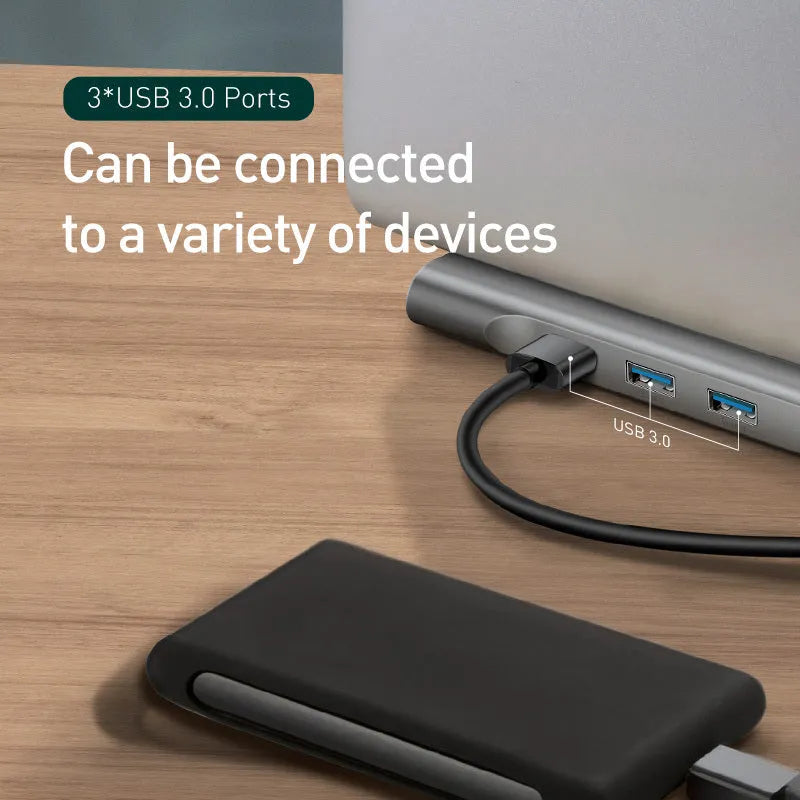 Grey aluminium USB C ten-port docking station with cooling bracket showing HDMI, VGA, and network ports