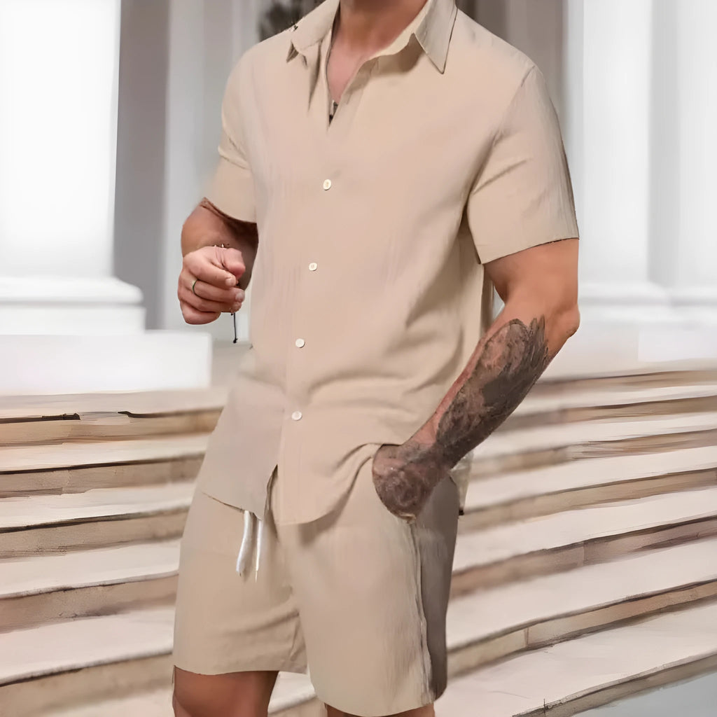 A striped printed casual suit for men, showing the short sleeve shirt and matching shorts on a hanger.