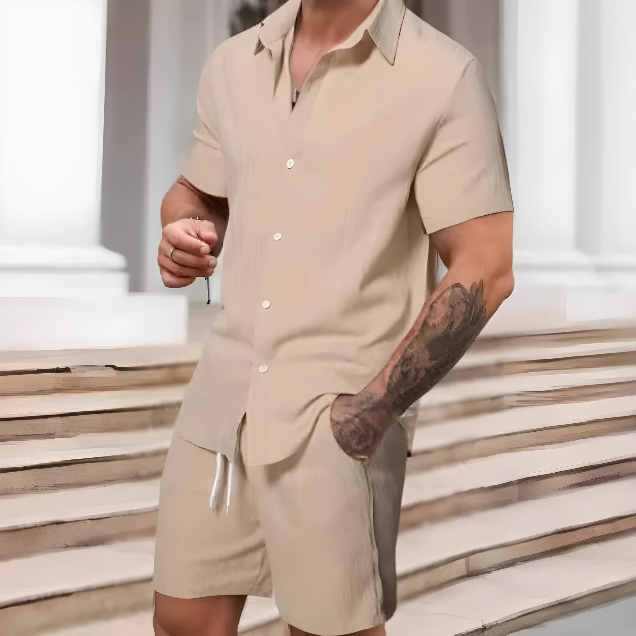 A striped printed casual suit for men, showing the short sleeve shirt and matching shorts on a hanger.