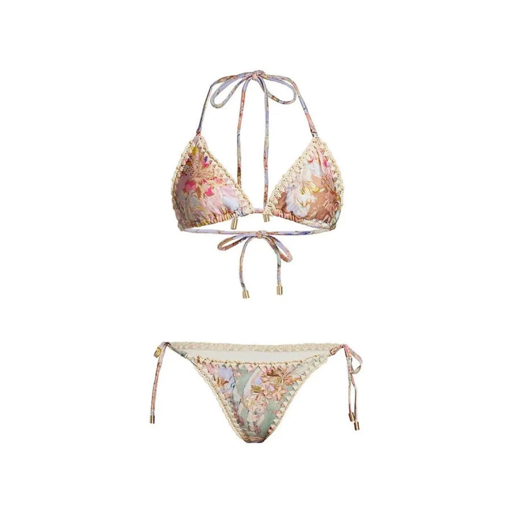Women's beige floral bikini set with matching skirt on neutral background