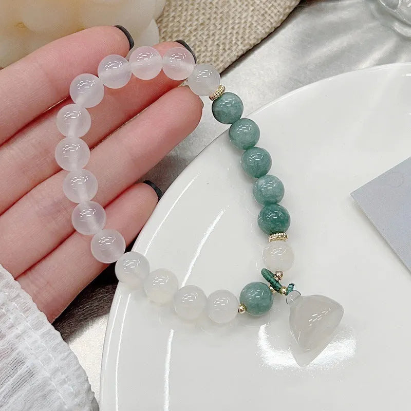 Women's retro Chinese style agate lotus seedpod bracelet with Burma jade accents on wrist