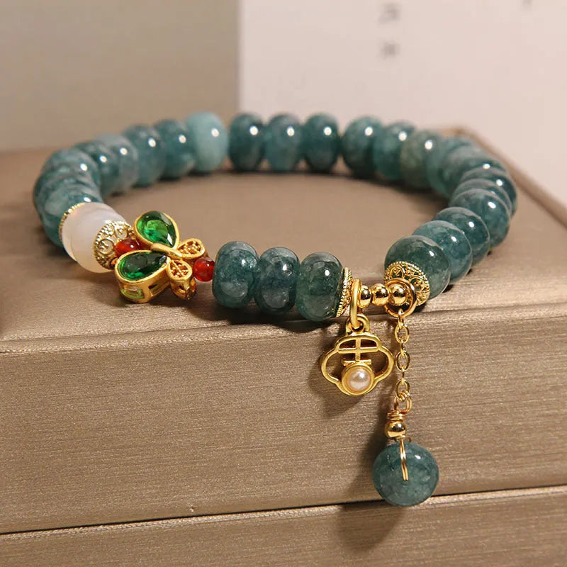 Women's blue water jade abacus bead bracelet with alloy inlay and white agate accents