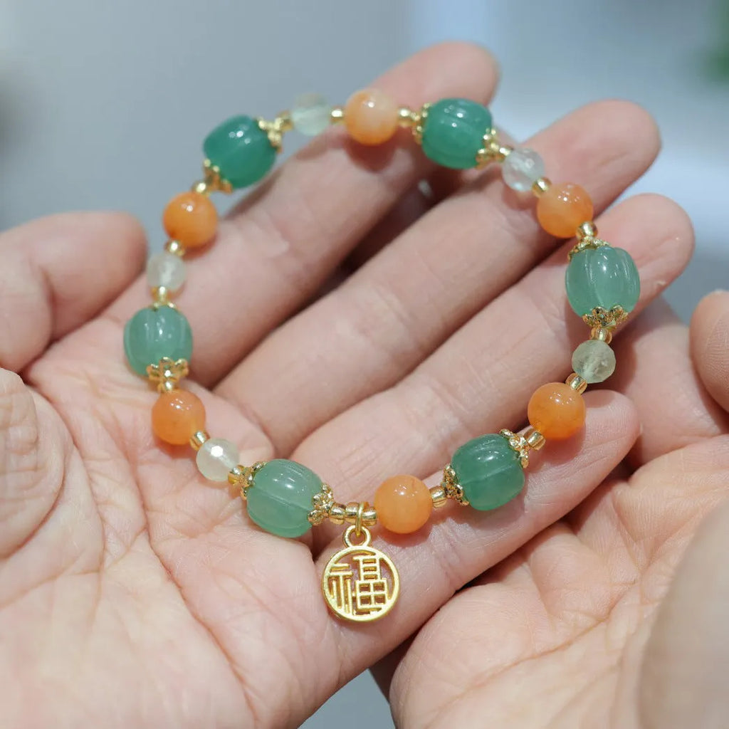 Duobao pumpkin bracelet for women with Jinsi Jade barrel beads and hanging charm on 14-16.5cm wrist