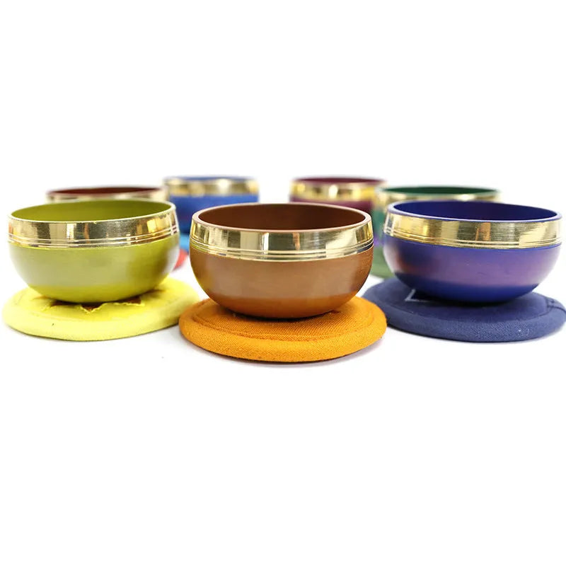 Handmade Himalayan singing bowl percussion instrument in multiple colours for meditation and yoga