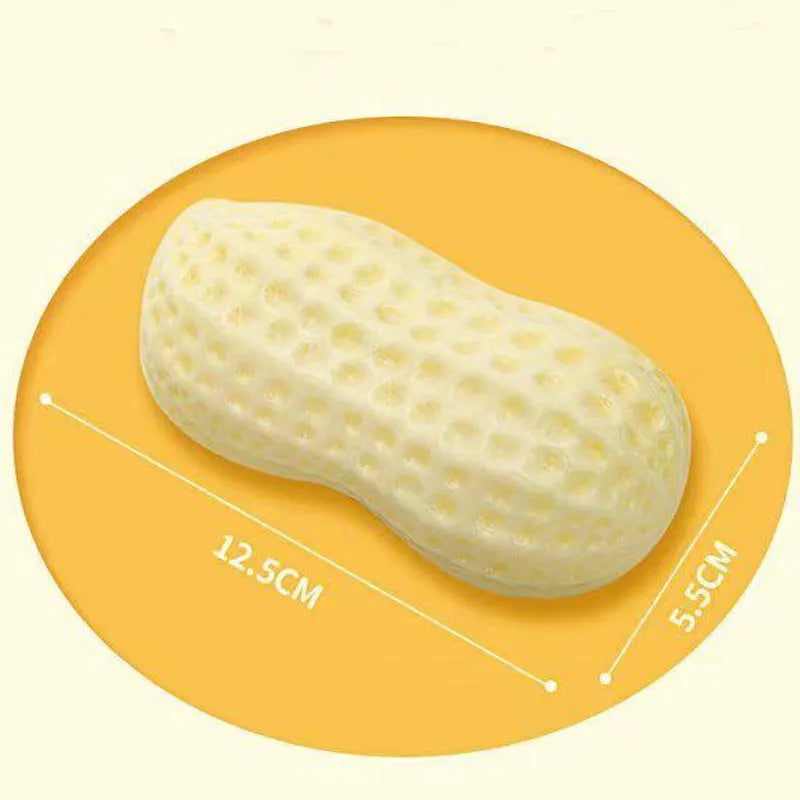 Yellow peanut-shaped dog chew toy with TPR rubber construction measuring 12x5.6cm