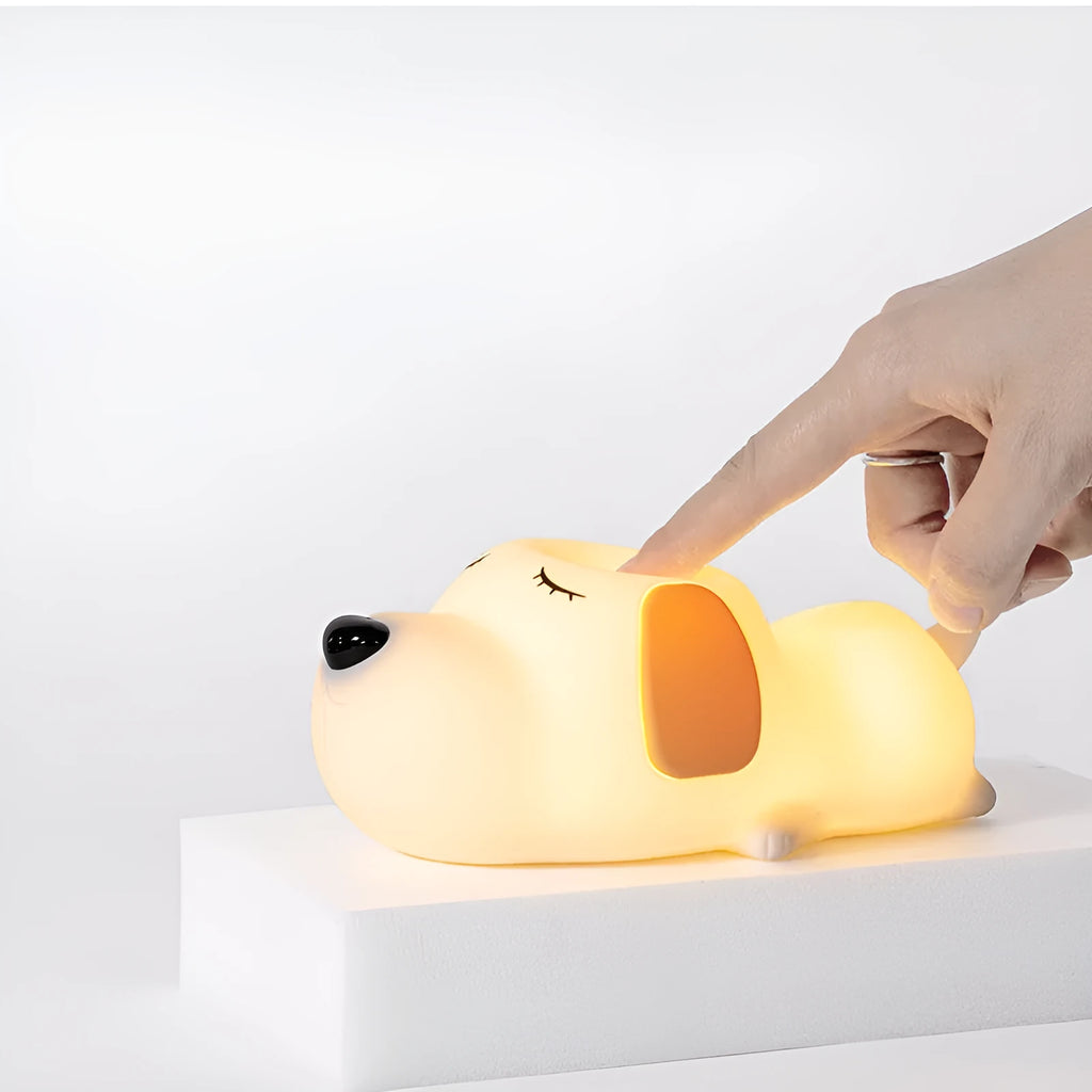 Cute two-colour cartoon dog silicone night lamp with USB cable for power.