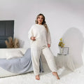 Women's creamy white polyester two-piece lounge set with crew neck top and matching trousers