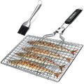 Square stainless steel folding barbecue mesh basket with a cleaning brush on a grill