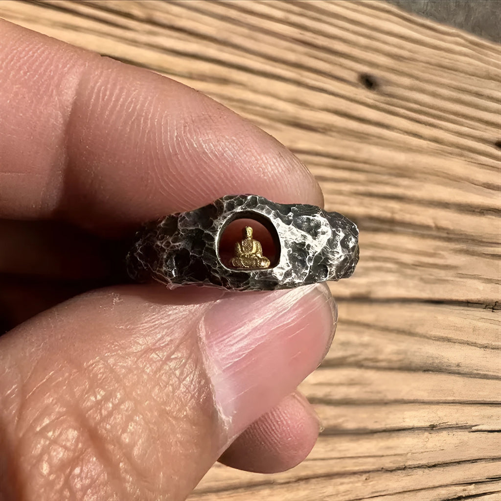 Hand-forged copper ring with a grotto Buddha design and textured rock finish, shown in size 8.