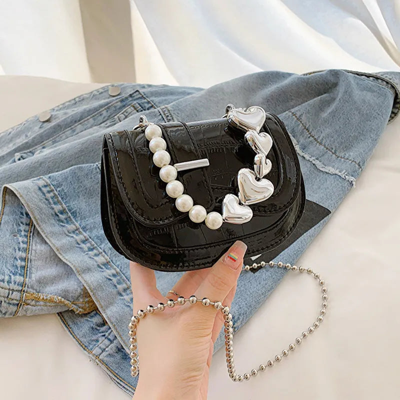 Women's silver PU mini saddle crossbody bag with phone pocket and single shoulder strap