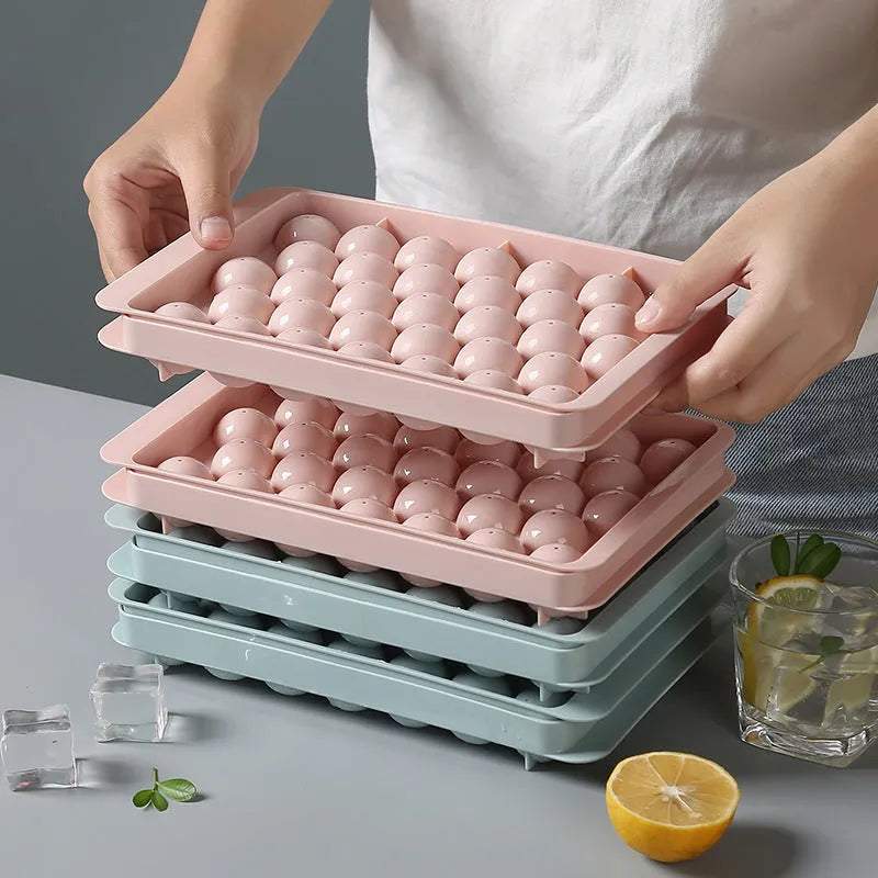 Sky blue round ball ice cube mould with 18 spherical cavities on a kitchen counter