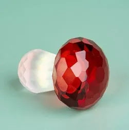 Colourful crystal mushroom decorative ornament in geometric modern style on a white background.