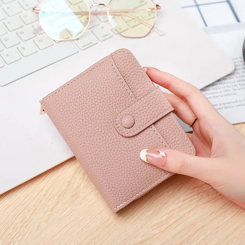 Women's lychee pattern short wallet in PU leather, shown in beige, pink, black, and red colour options.