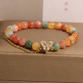 Fu Lu Shou crystal bracelet for women with gold tone metal settings and V-shaped zircon design