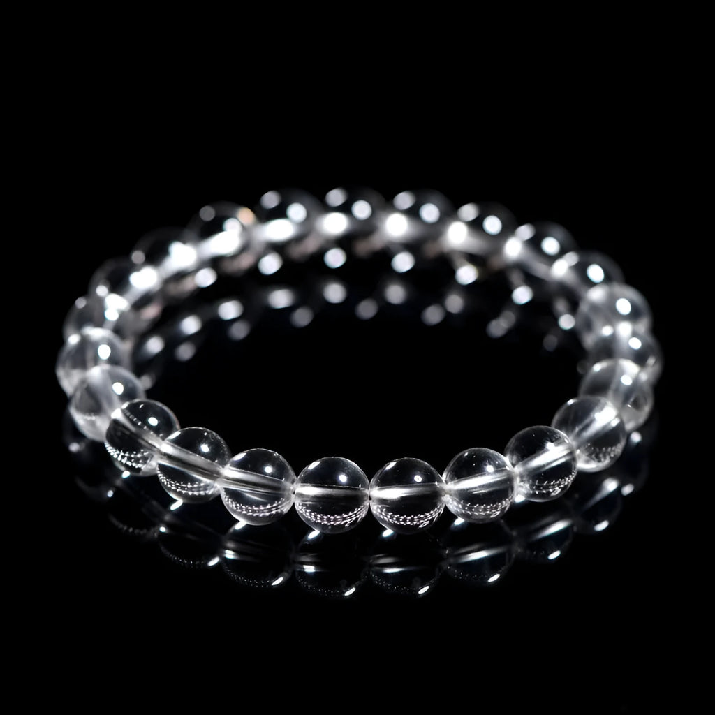 White crystal bracelet with round beads in various sizes from 6mm to 14mm diameter