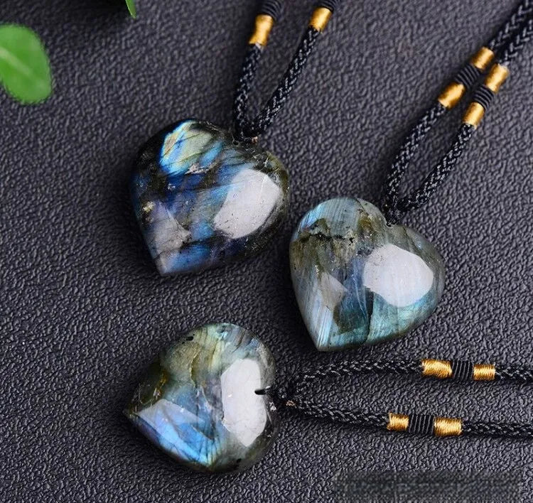 Natural labradorite moonstone crystal necklace with geometric blue pendant on a silver chain.