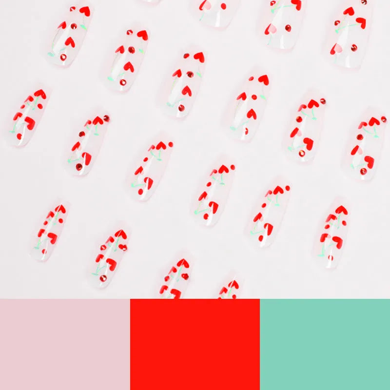 French-style red diamond and small cherry design nail art armour sheets and glue tube.