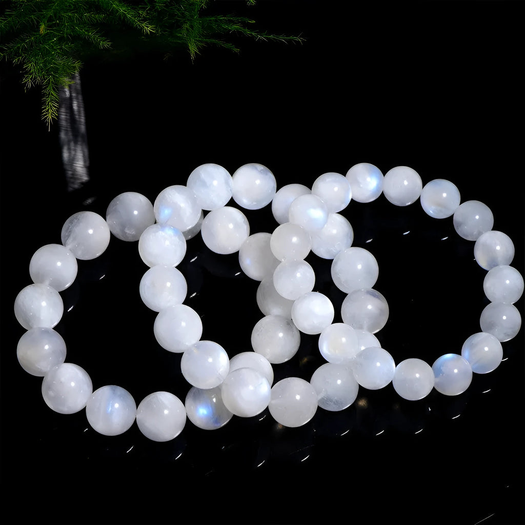Polished moonstone bracelet with round blue beads showing natural colour variations