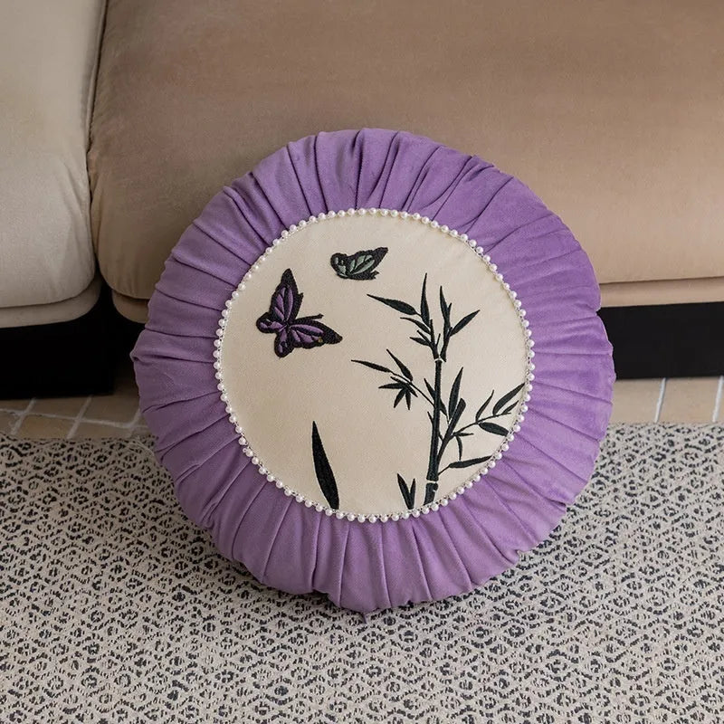 Square beige cushion with detailed black and purple butterfly embroidery in a Chinese style.