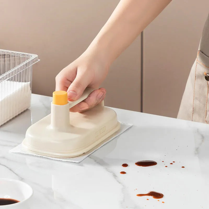Magic Brush disposable cleaning brush with handle, 50 white rag refills, and a storage box holder.