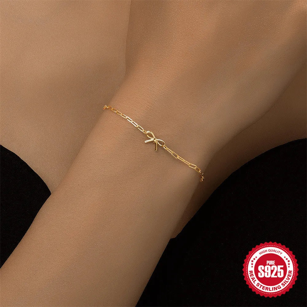 Gold tone S925 sterling silver bracelet with clip chain and glossy heart charm