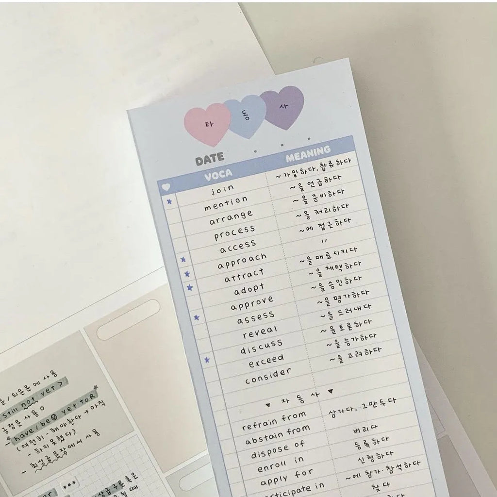 Half B5 vertical notepad in pink, purple or blue cover measuring 9.1 by 25.7 cm with 30 sheets