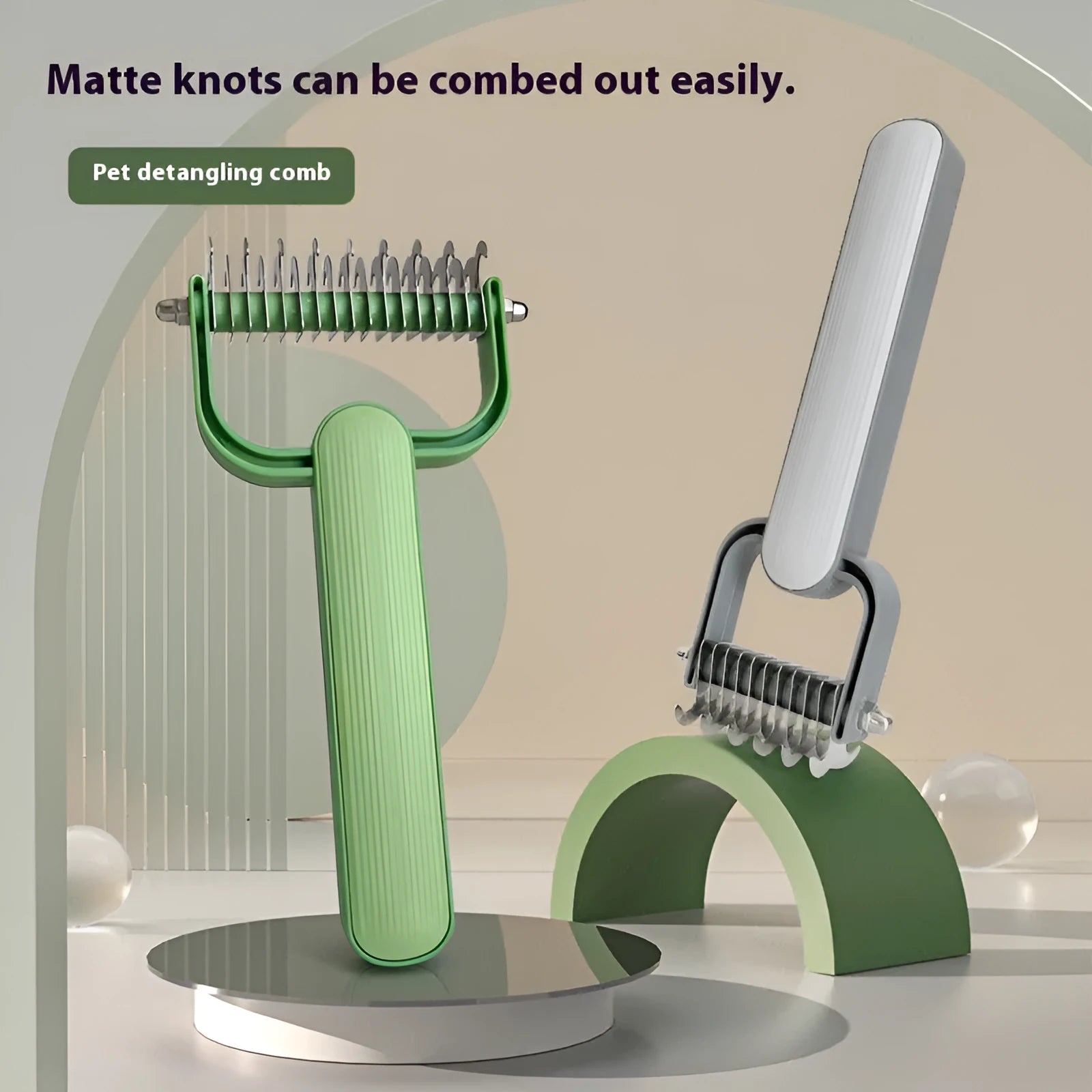 Green or grey dog grooming comb with stainless steel unknotting teeth and plastic handle.