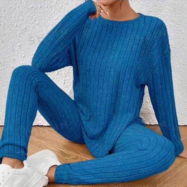 Women's black sunken stripe casual two-piece homewear set with short sleeve top and trousers.