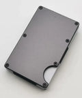 Carbon fibre credit card wallet in aluminium alloy grey, showing slim profile and card slots.