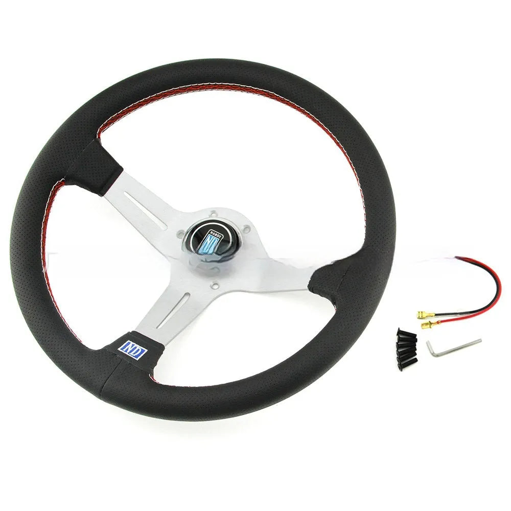 14-inch leather steering wheel with a concave rim and black metal skeleton spokes.