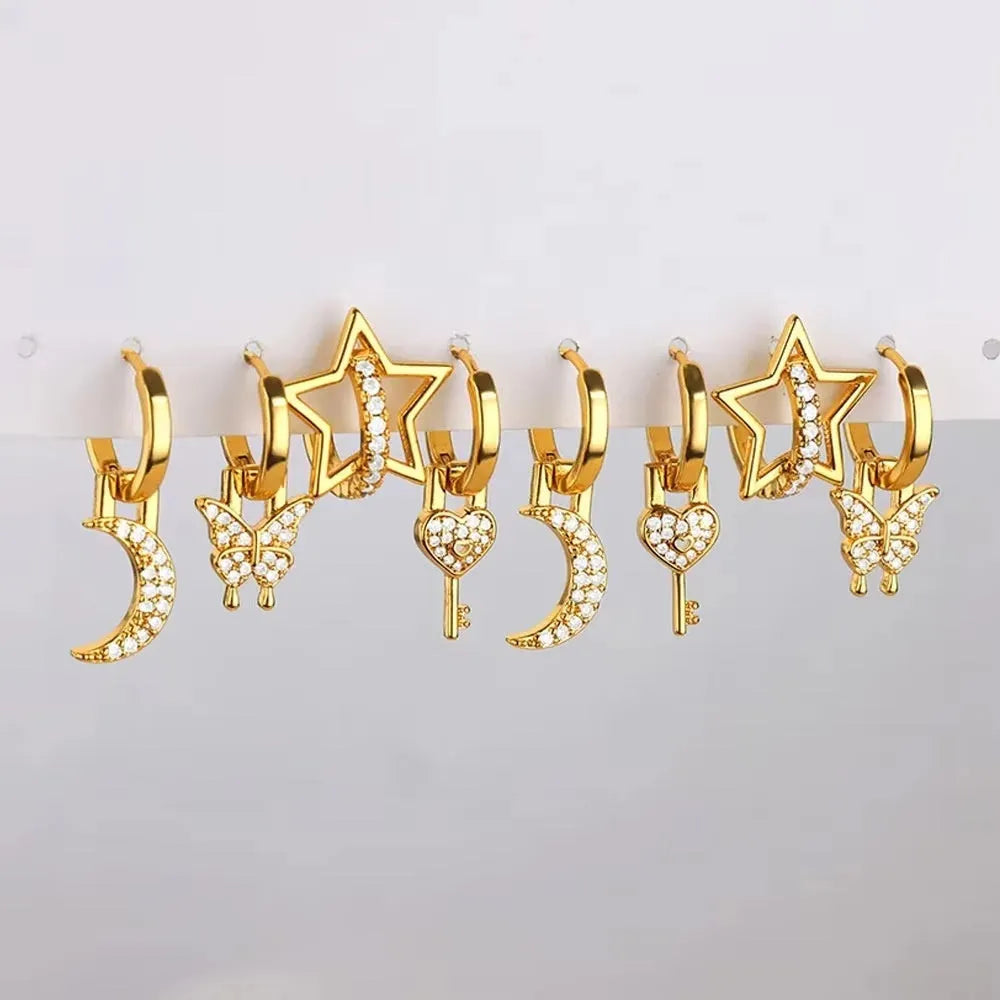 Geometric butterfly earrings with heart and star shapes in copper with diamond treatment