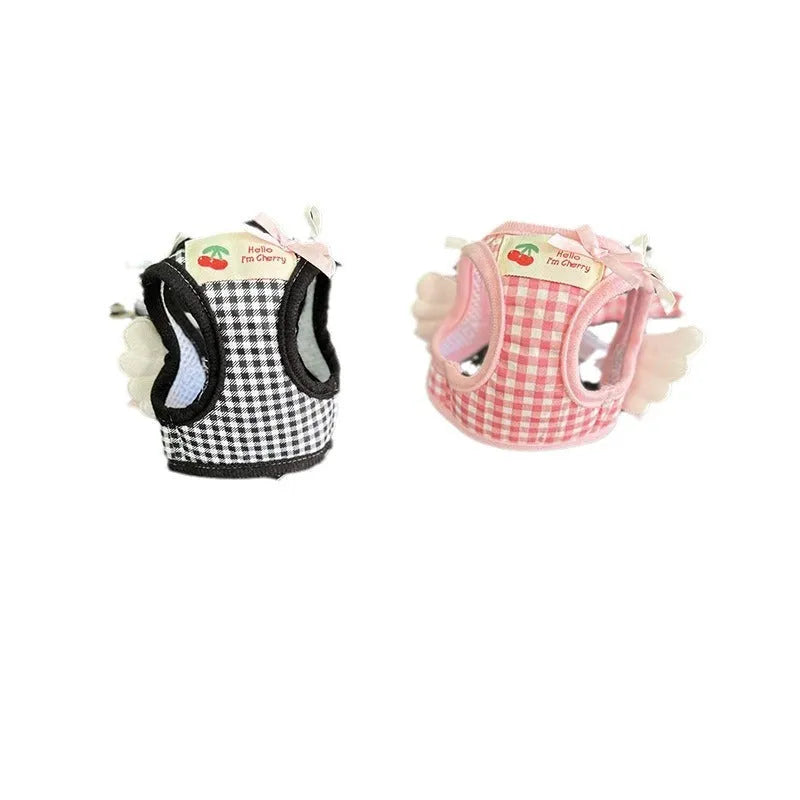 Small dog wearing pink cotton harness with chest and back leash attachment points