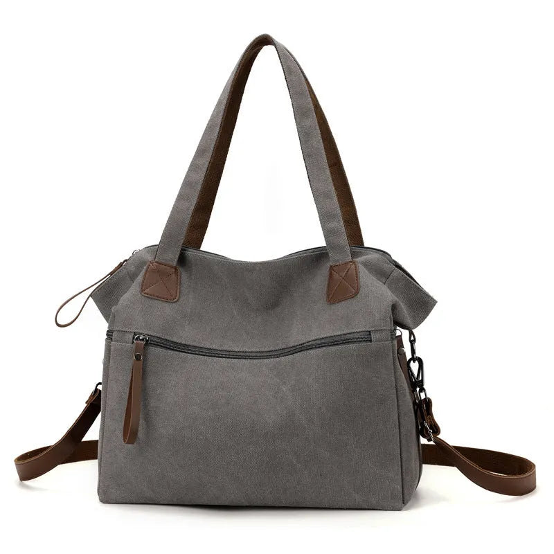 Retro style soft canvas shoulder bag for women in a horizontal square shape with internal organisers.