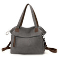 Retro style soft canvas shoulder bag for women in a horizontal square shape with internal organisers.