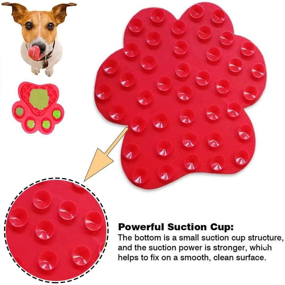 Bone-shaped blue silicone dog licking mat with suction cups on smooth surface