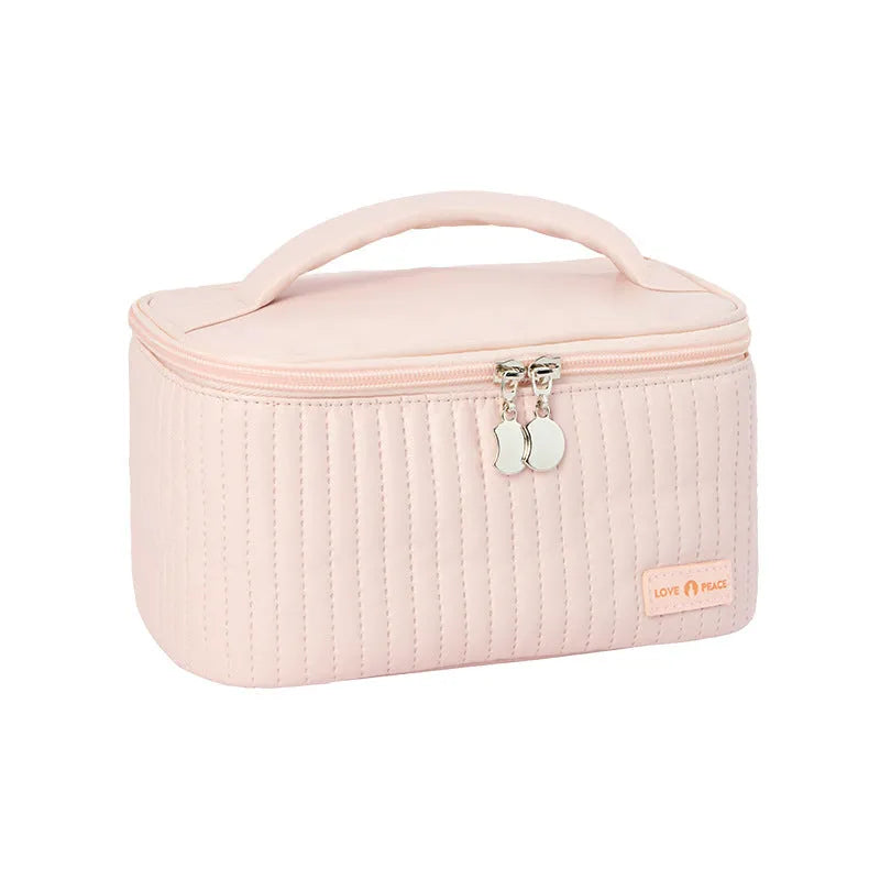 Open-top cake style makeup bag in PU leather, shown in beige, with dimensions 24cm by 16cm by 13cm.
